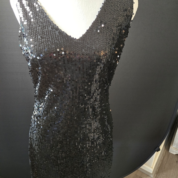 Available Dresses & Skirts - Stunning Black Sequin V Neck and Slight V-back Opening Back Of Neckline.